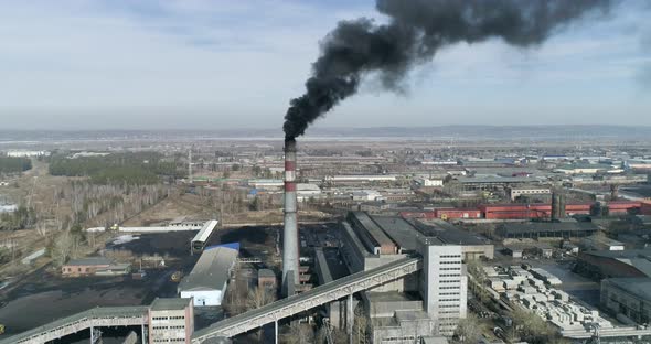 Top View of Coal-fired Power Station Smoking Smokestack Black Smoke Coming From Chimney alt
