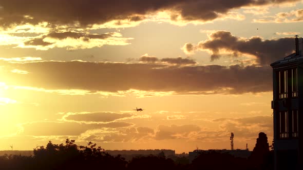 Airplane is Landing at Sunset alt