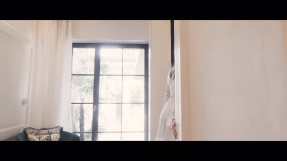 Woman walking In A Beach House alt