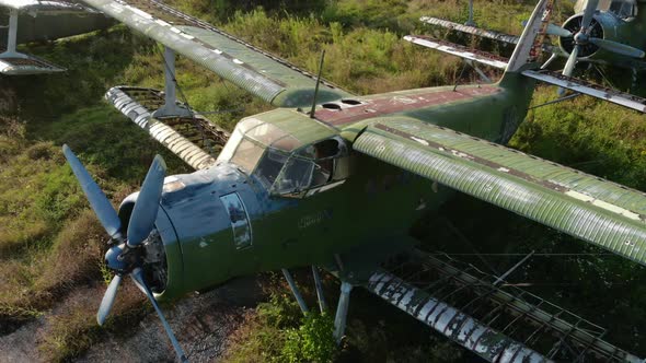 Destroyed Rusty Green Antonov2 Airplane on Grass Airfield
