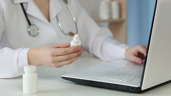 Woman Physician Filling Out Online Prescription Form, Doctor Working on Laptop alt