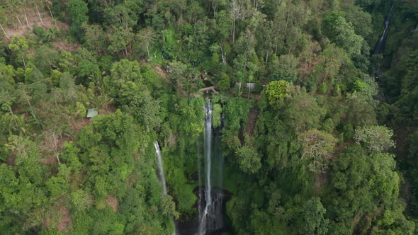 Drone Over Sekumpul Waterfalls In Forest alt