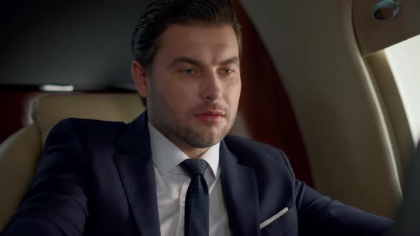 Serious Businessman Having Video Chat Closeup alt