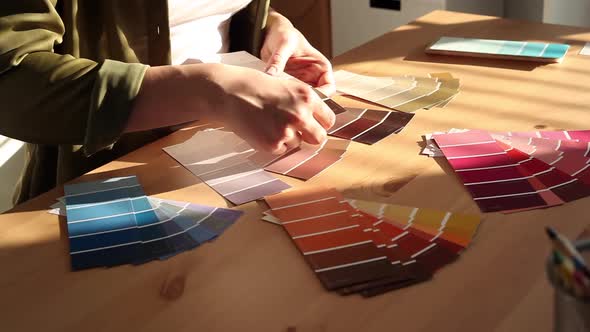 Designer Chooses Best Color Samples for the Client