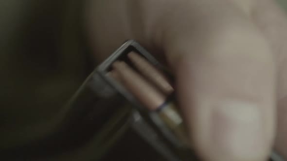 Cartridges Charge. Close-up. Slow Motion alt