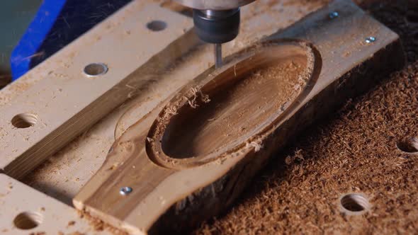 Automatic Milling Cutting Wood Machine. Drill Holes for the Pieces of Wood. Closeup. alt