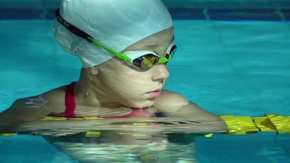Teenager Girl Face in Swimming Pool. Close Up of Woman Portrait Smiling in Resort Pool Water alt