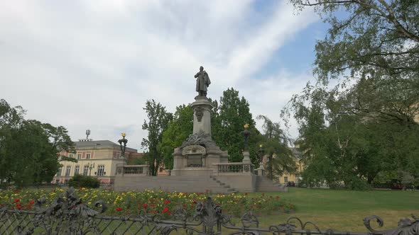 Statue of Adam Mickiewicz in a park