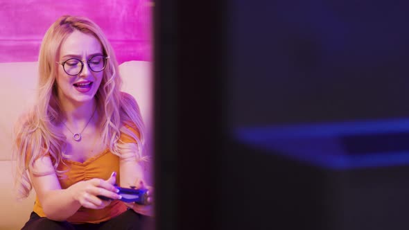 Beautiful Blonde Girl Upset Because She Lost While Playing Video Games