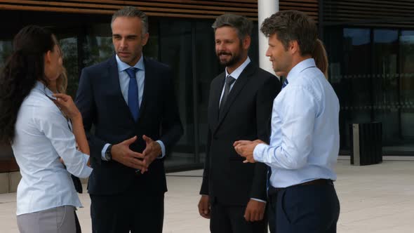 Business people interacting with each other alt