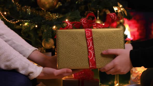 Girls Give Christmas Gifts