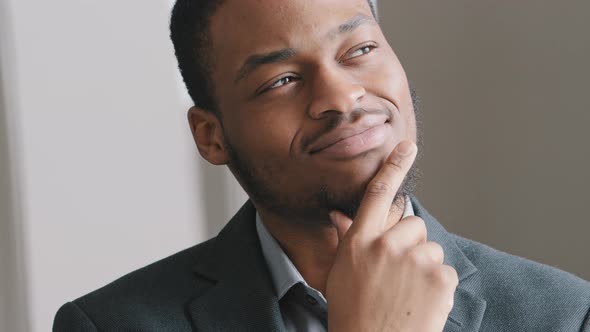 Happy Dreamy Satisfied Young Afro American Man Student Teacher Professional Look Away Thinks Over alt