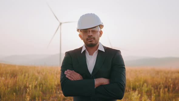 Portrait Indian Businessman in Black Suit White Helmet and Safety Glasses Posing alt