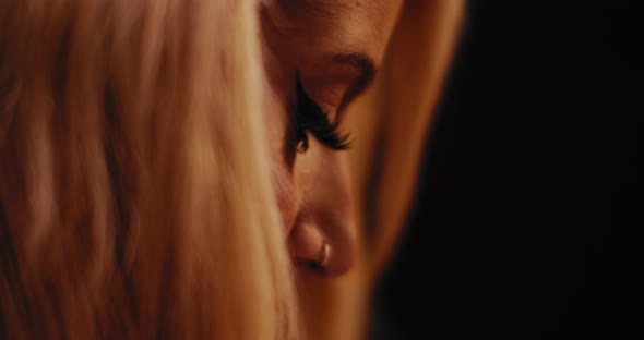 Close up of a young female tattooist during her work. BMPCC 4K alt