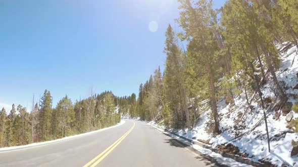 POV point of view -Driving through Rocky Mountain National Park in the Spring. alt