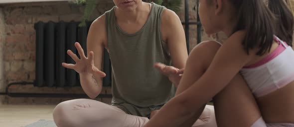 Sporty Mother Chatting with Little Girl alt