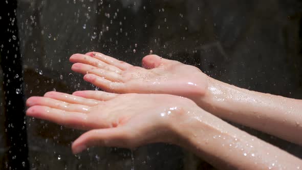 Drops of Water Drop On Women's Hands