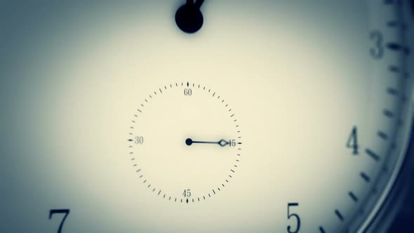 Time-lapse animation of a clock with the fast turning hand of clock. Closeup. HD alt
