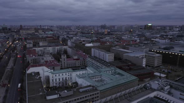 AERIAL: Slowly Flying Over Center of Berlin Germany with Construction Site Cranes at Sunset  alt