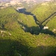 Aerial view of karst landscape, with valleys and cliffs, at sunset - VideoHive Item for Sale