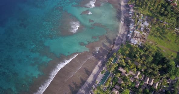 Drone Shot of Beach Coast with Crystal Blue Water and Local Village alt