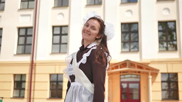 Happy Russian Female Graduate Posing on Her Graduation Day alt