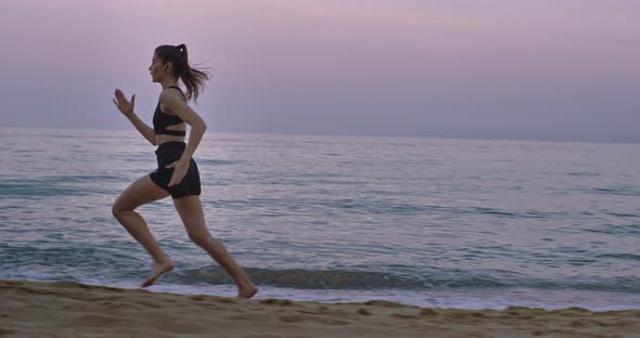 Professional Running Lady in the Morning Beach alt