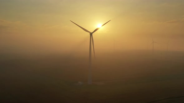 Windmills in Rotation at Fog Sunrise alt