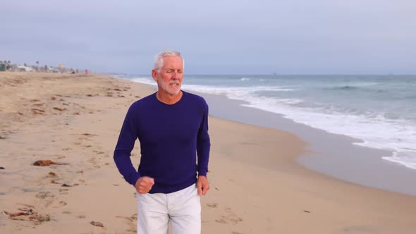 Mature Man Exercising At The  Beach alt