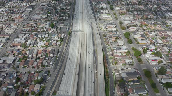 AERIAL: Slow Overhead Lookup Over 110 Highway with Little Car Traffic in Los Angeles, California on alt