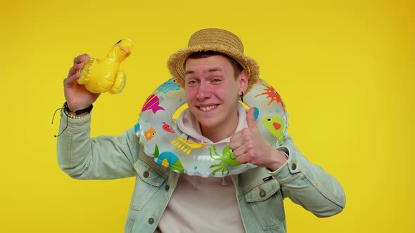 Traveler Tourist Student Man Dancing Fooling with Swimming Ring and Duck Toy Travel on Weekends alt