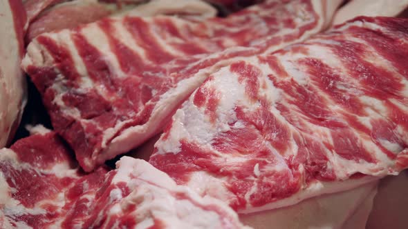 Raw Pieces of Meat on the Ribs Laid Together. Food Factory, Fresh Meat Processing Plant. alt