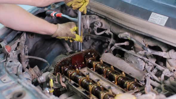 Car mechanic working in service center