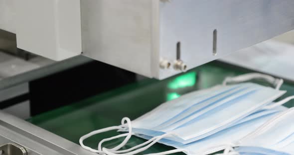 Medical Face Mask Making Machine - Mask Production Line - closeup, pan right alt