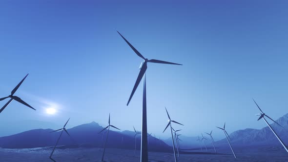 Tall wind turbines spinning in the mountains, creating energy from environment.