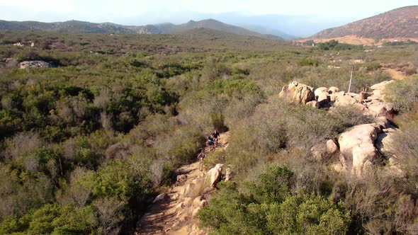 4K Mountain Bikers Competition Cycling Through Canyon Trail alt