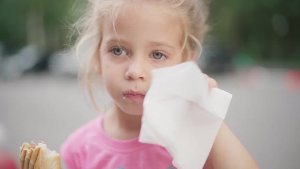 Little Girl Eat Hot Dog Summer Park Food And Drink Concept alt