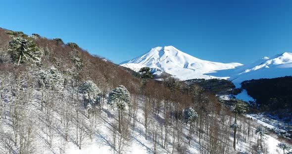 Reveal Of Giant Snowy Volcano Chilean Andes Mountains Aerial Drone Shot alt