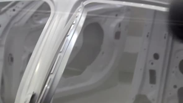 car painting with robots in car factory alt