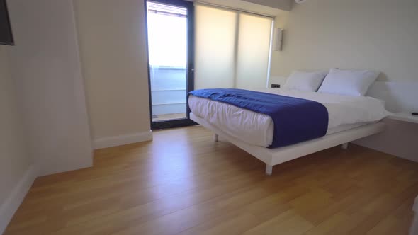 New apartments in hotel. camera flies all over room, living room with a bed alt