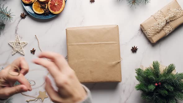 Woman Packaging Christmas Presents alt
