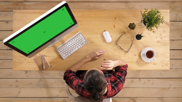 Young female call center employee. Green Screen Mock-up Display. alt