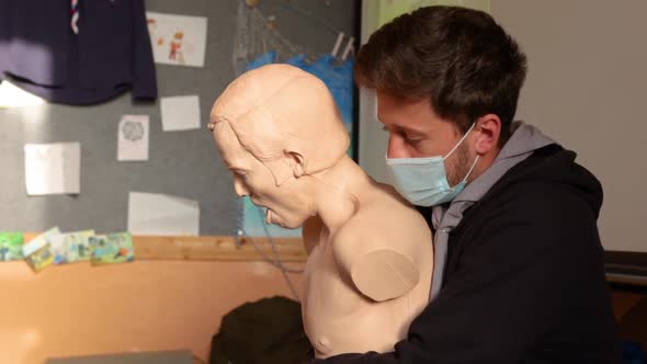 Demostration of what to do when a person is choking alt