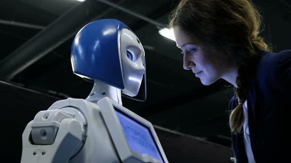 Girl Talking To a Humanoid Robot, Stock Footage | VideoHive