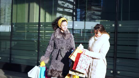 Two Friends After Shopping Chat in the Street