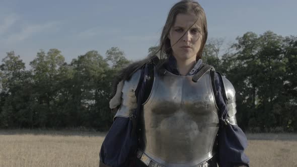 A furious swordsman fights against the enemy. Slow motion. alt