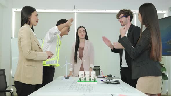 architects team tap your hand to do a high-five pose after the presentation