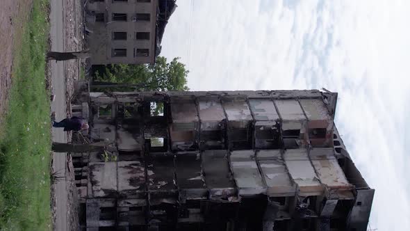 Vertical Video of Civilian Cars Destroyed During the War in Ukraine alt