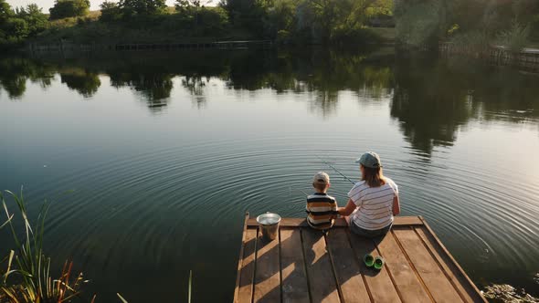 Mother with Her Little Son on a Fishing Trip