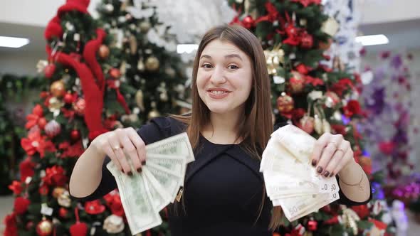 The Womanseller of the Store with Bundles of Money in the Hands Rejoicing in the Eve of Christmas